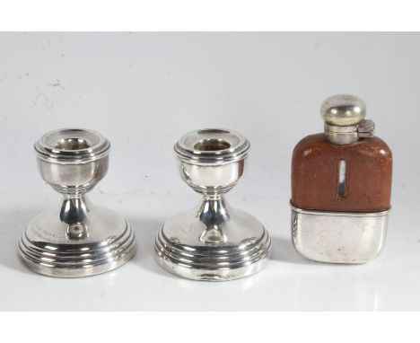 Matched pair of squat silver candlesticks, one with inscription dated 1967, small brown leather and plate mounted clear glass