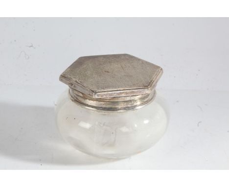 George V silver lidded clear glass powder bowl. Birmingham 1933, maker Adie Brothers Ltd. the hexagonal engine turned silver 