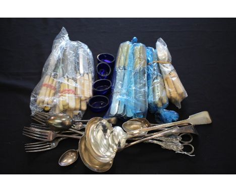 Silver plated cutlery and flatware, to include ladles, grape scissors, nut crackers, sugar tongs, six blue glass salt liners 