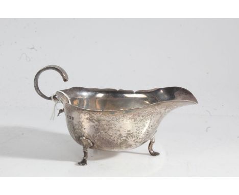 Edward VII silver sauceboat, Birmingham 1909, maker Horace Woodward &amp; Co Ltd. with double scroll handle and wavy rim, rai
