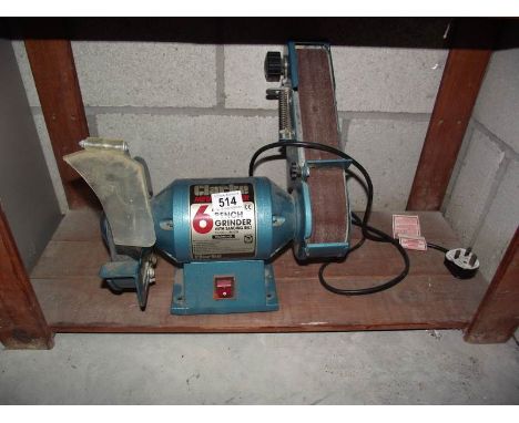 A Clarke 6" bench grinder with sanding belt.