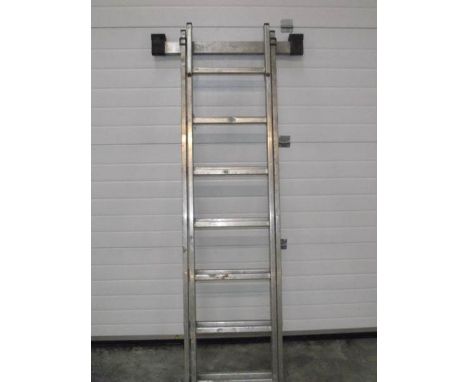 A galvanised aluminium double extending ladder.