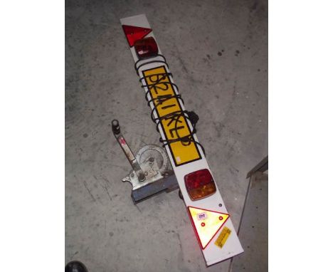 A trailer light board and a winch.