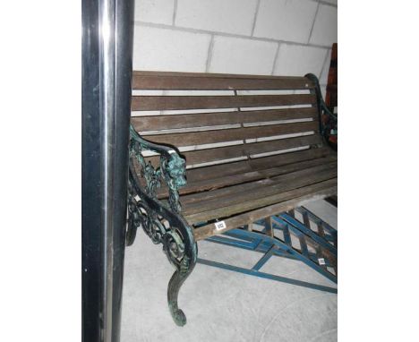 A garden bench with cast iron ends.