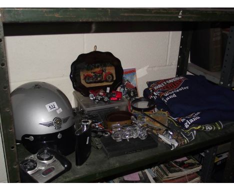 A quantity of Harley Davidson memorabilia including flag, sweaters, models, helmet etc.,