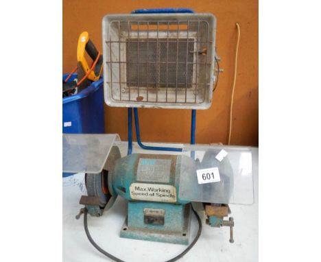 A bench grinder and a propane gas heater.