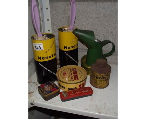 A vintage Dunlop tyre and rim paint tin and other tins.