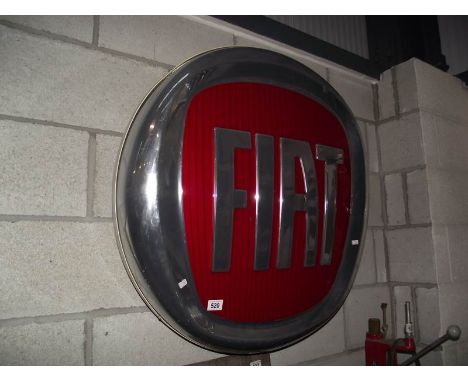 A large plastic Fiat main dealer light up sign.
