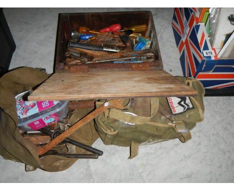 A wooden box and 2 canvas bags of spanners and other tools.