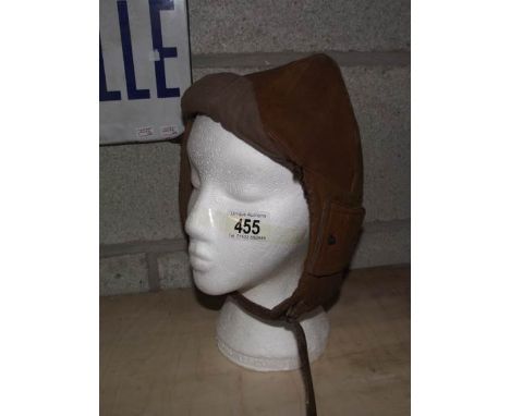 A vintage leather motoring helmet (head not included).