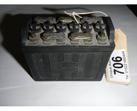 A vintage model of an Exide battery match holder.