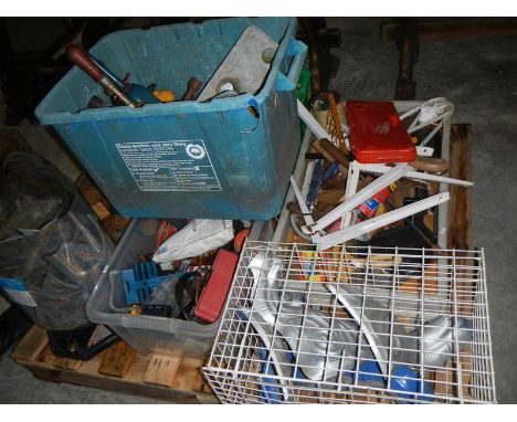 Pallet contents including miscellaneous tools, cast iron bath legs.