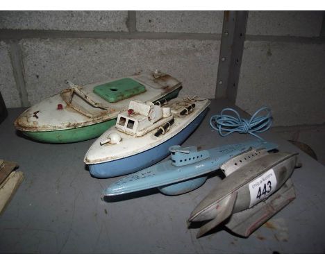 Tinplate clockwork boats and submarines by Sutcliffe and Mobo.