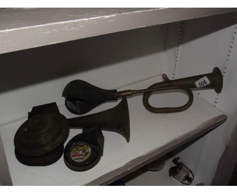 A vintage jubilee No.68 piggy back diesel diesel trumpet car horn and a brass car horn.