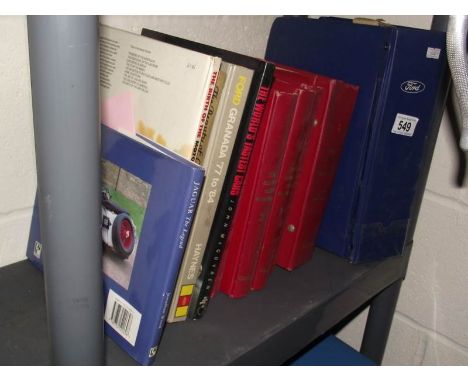 A shelf of books on motoring.