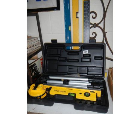 A boxed Power Master laser level etc., including set squares and spirit level.