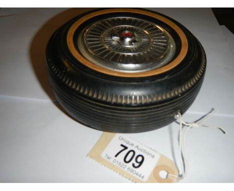 A vintage transistor radio in the form of a wheel, made in Japan.