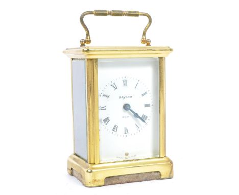 Bayard - Mid 20th century French brass carriage clock. With carry handle to top, Roman numeral chapter ring with ebonised han