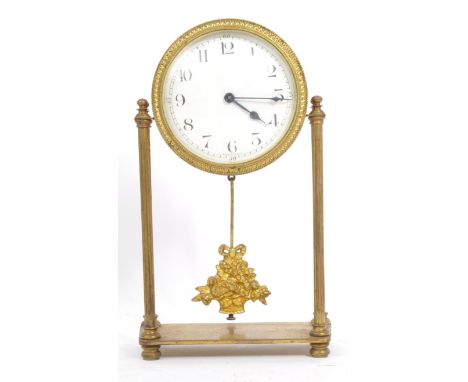 A 19th century French barrel drum case portico mantel clock. Of brass construction with round white enamel face and Arabic nu