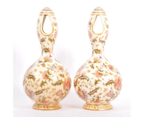 A pair of 20th century Hungarian Zsolnay Pecs vase. Of ceramic construction with circular top, two tear drop pierced holes, i