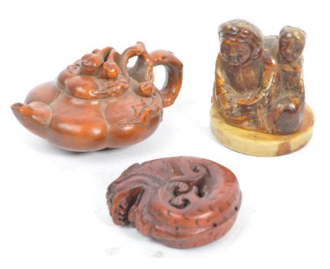 A collection of late 19th century Japanese netsuke carved fruit wood figures. Comprising of a teapot with foliate top and han