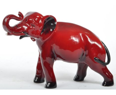 A 20th century Royal Doulton ceramic china flambe elephant statue figure. The figure being in the form of a standing elephant