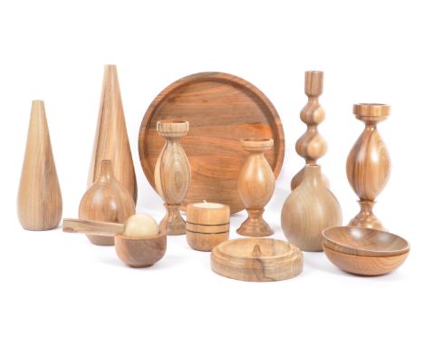 A large collection of contemporary fruitwood decorative ornaments. The collection to include various turned candlesticks and 
