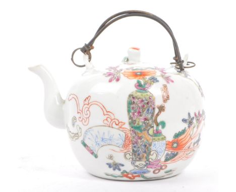 A late 19th century Chinese porcelain teapot. The teapot having white ground with hand painted decoration to the side display