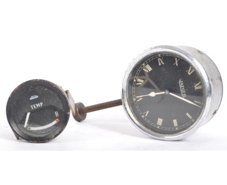 Jaeger - A vintage chrome Jaeger car clock face having black face with white roman numeral to chapter ring. Accompanied by a 