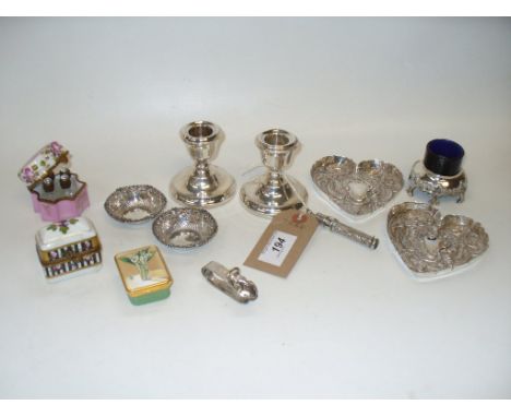 Two silver heart shaped shallow trinket dishes, London 1894 ( 2.5 ozs), a pair of weighted silver dwarf candlesticks, 2 small