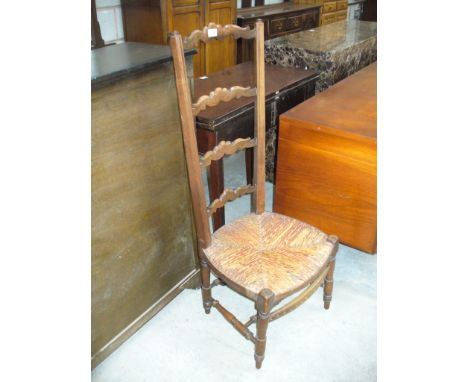 A Beech wood ladder back rush sated side chair.