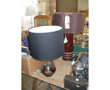 A Cylindrical ceramic table lamp  and a glass bottle shaped table lamp c/w shades (2)

