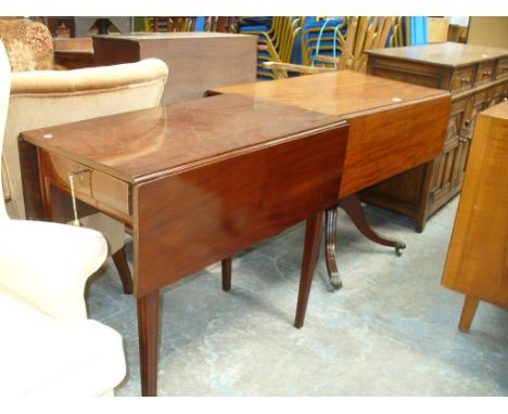 A 19th century mahogany Pembroke table with a single drawer on a turned shaft and four downswept supports and an Edwardian in