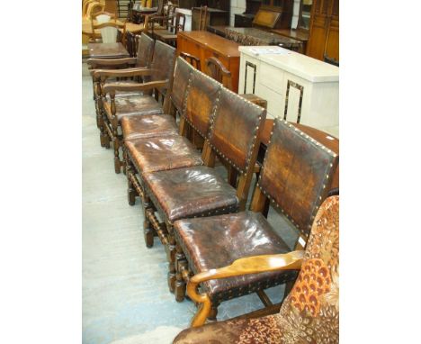 A Set of 6 early 20th Century oak and studded leather Jacobean revival dining chairs on bobbin turned and block supports incl