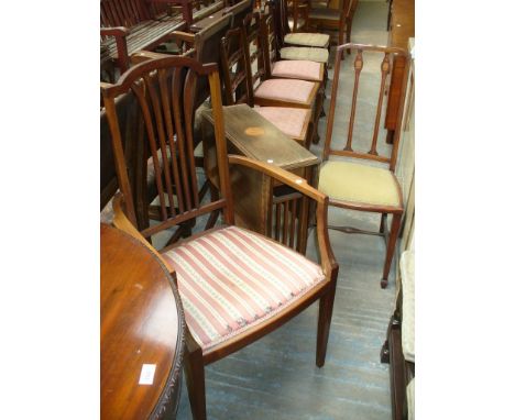 An Edwardian inlaid mahogany Sutherland table, an Edwardian bedroom chair and an elbow chair. (3)