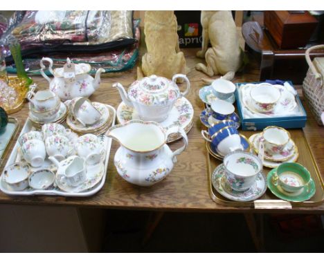 A Roslyn 'Moss Rose' floral pattern tea service, a Paragon 'Country Lane' teapot and dinner plates, a Mintons floral pattern 