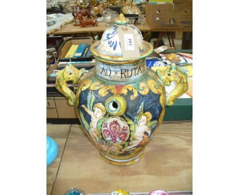 An Italian Majolica style wet drug Albarello 
Of tapered ovoid form, flanked by twin serpent handles, and single nozzled spou