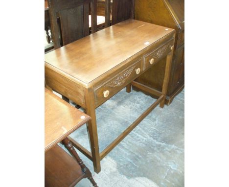 An Early 20th Century oak two drawer side table.