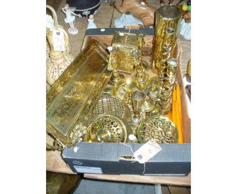 A Qty of brass ware to include open twist candlesticks, brass trivets, assorted ornaments, caddy , brass plaque, qty.