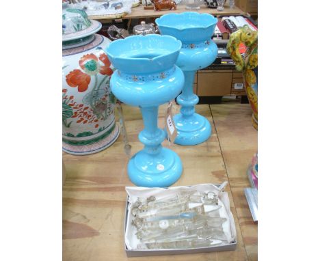 A pair of Victorian blue glass table lustres 
Each of typical form, the scalloped upper open bowl, extending to rounded body 