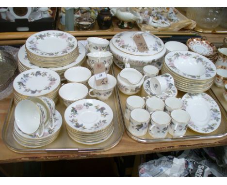 An extensive Royal Worcester 'June Garland' tea and dinner service comprising tureens, side, dinner plates, cups, saucers, co