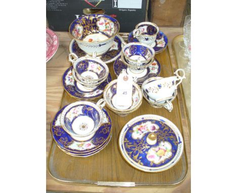 A 19th Century cobalt blue gilt and floral pattern tea service comprising cups, saucers, slop bowl, sugar basin (22). CONDITI