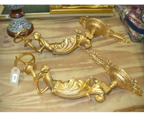 A pair of gilt metal Louis XVI style figural wall appliques in the manner of Ferdinand Barbedienne
The stepped and domed wall