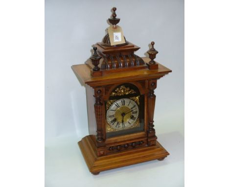 A Victorian walnut bracket clock with a silvered bezel over a gilt metal dial , two train movement.