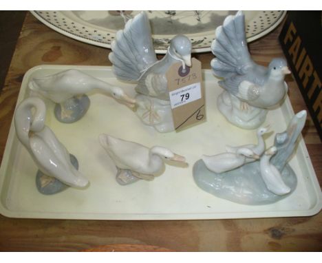 Three assorted Lladro geese figures, a Nao group three ducks and a pair of pigeon figures.(6)