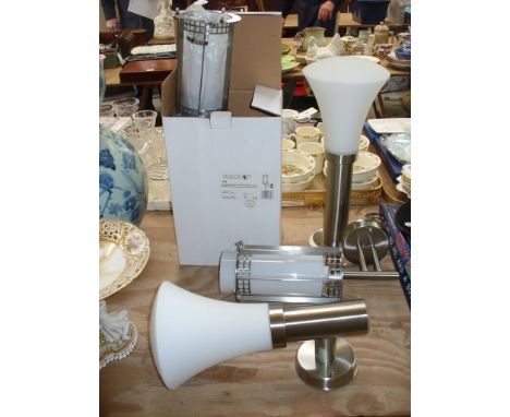 A pair of stainless steel outdoor wall mounted light fittings , boxed. ( 340 ) and two boxed outdoor stainless steel lights w