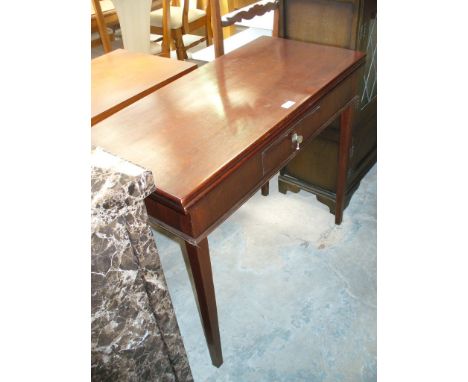 A 19th Century mahogany folding tea table
The rectangular hinged top above a single frieze drawer raised on legs of tapering 