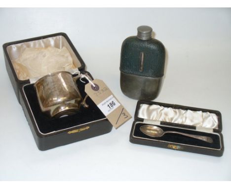 A Cased silver commemorative cup, Birmingham 1934, cased silver teaspoon and a leather and plate mounted glass hip flask. (3)