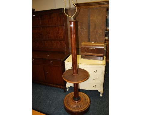 AN EDWARDIAN MAHOGANY LAMP STANDARD