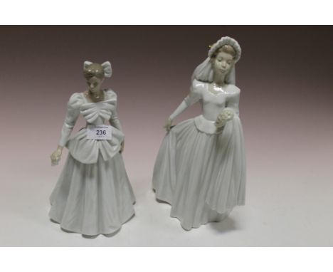 A NAO FIGURE OF A LADY HOLDING A HANDKERCHIEF TOGETHER WITH ANOTHER (2)